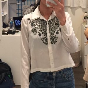 White button up blouse with black detailing